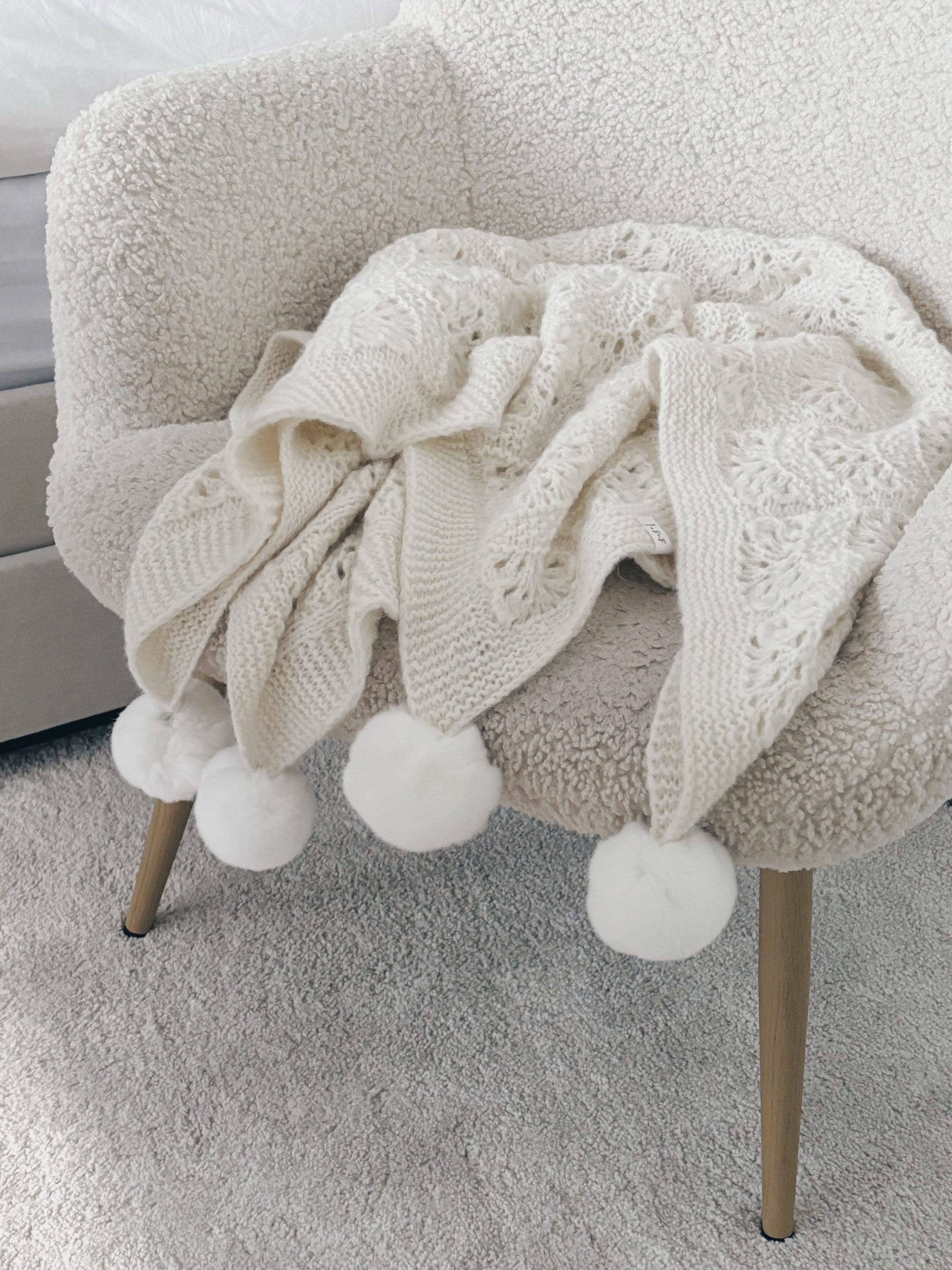 il_fullxfull.5685947381_rejq Hand Knitted Cream Alpaca Baby Blanket – Fur Pom Poms - Image 1