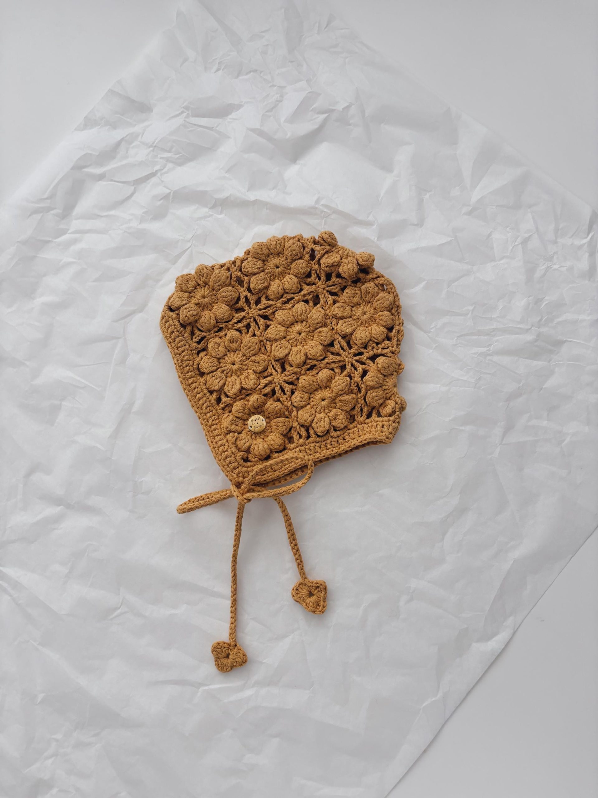 il_fullxfull.6813525197_anpd Hand Crochet Baby Bonnet – Mustard Flower, 12-18 Months - Image 1