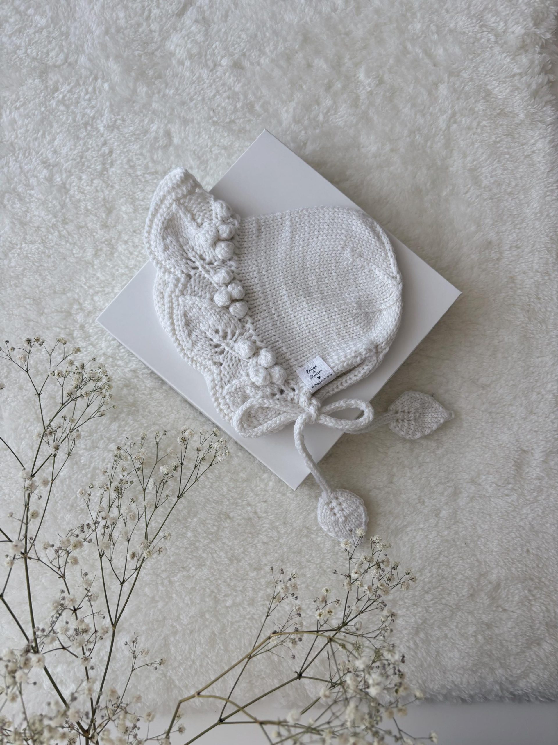 il_fullxfull.6904488501_cqtr Hand Knit Merino Baby Bonnet - White Leaf Design - Image 1